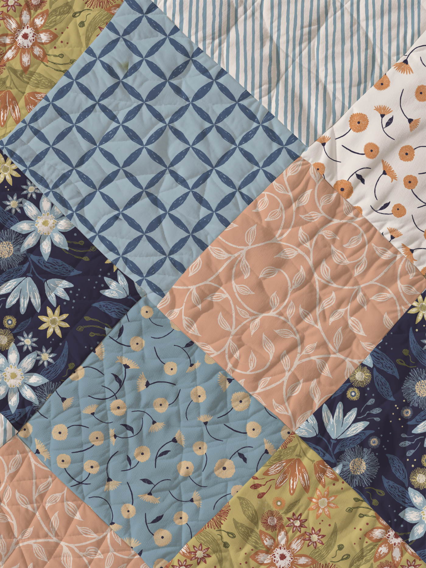 Quilted fabric samples featuring coordinating Botanical Reverie patterns in blue, ivory, peach, olive and navy from the Heritage Garden colorway.