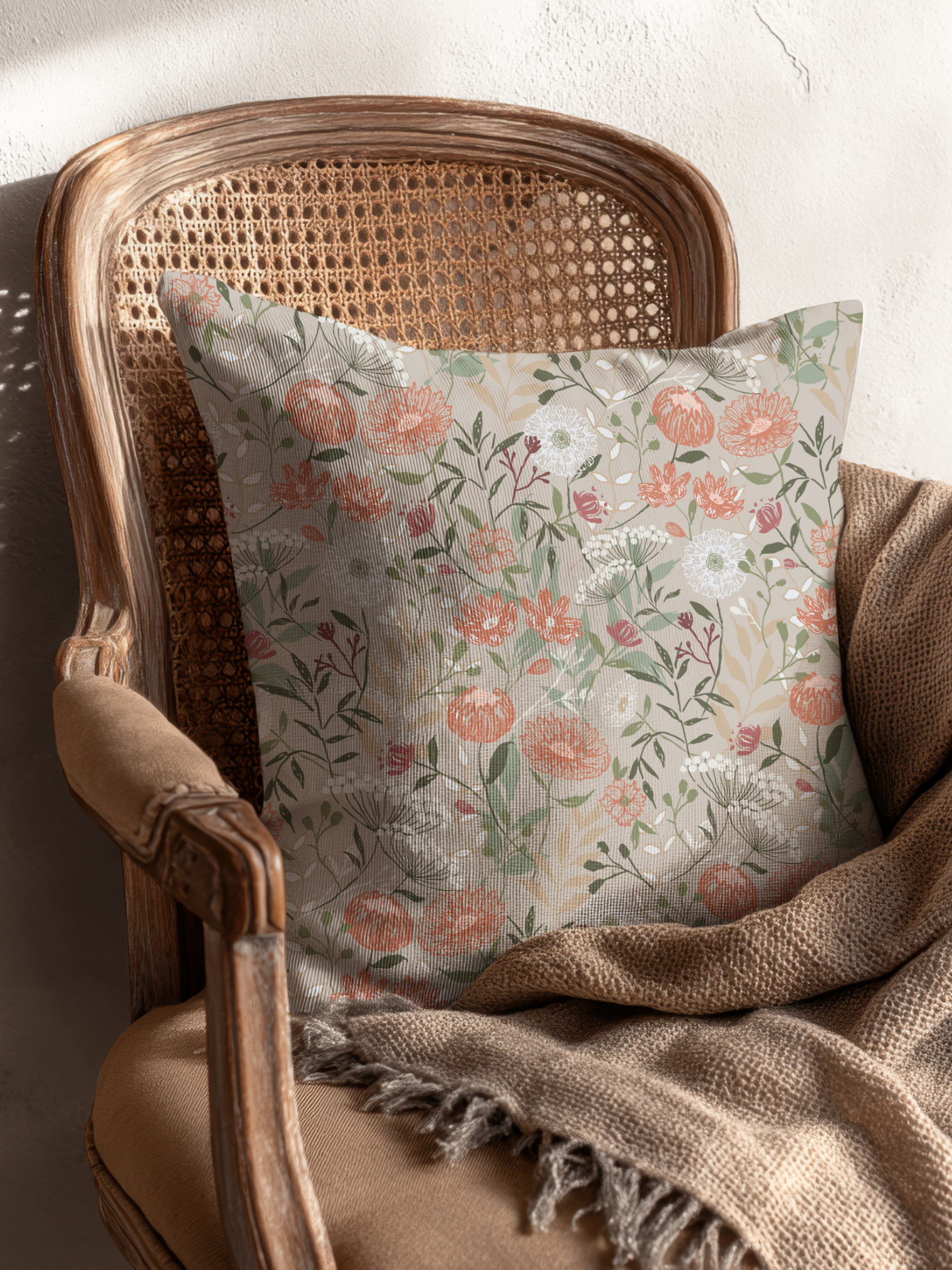 Atelier Botanique Vintage Bloom floral pattern on a decorative throw pillow in a vintage armchair
