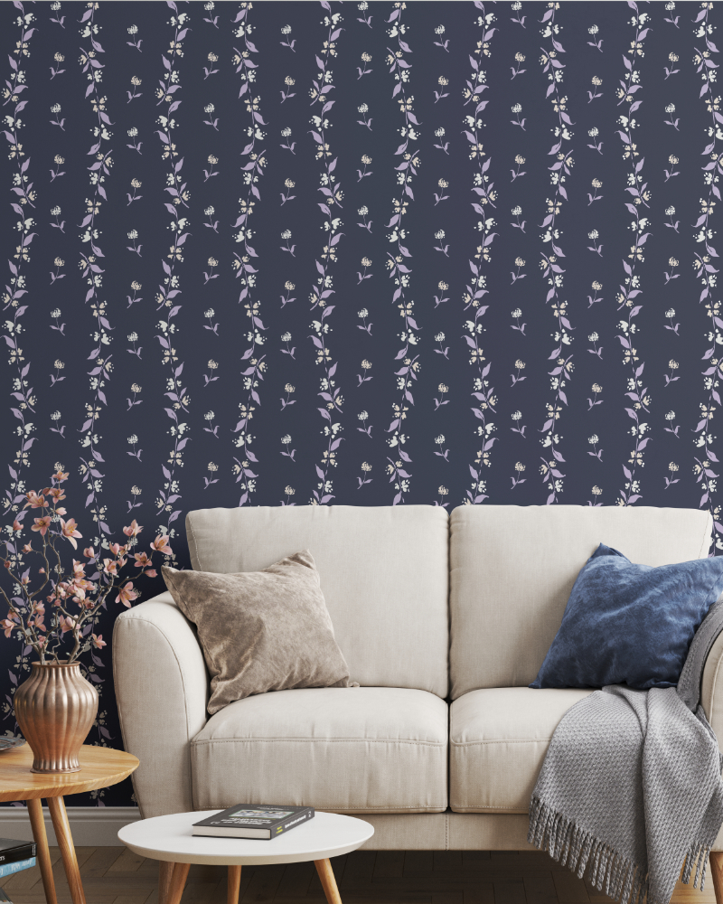 Elegant living room with Garden Sprigs floral wallpaper from the Botanical Reverie collection in the Heritage Garden colorway, featuring delicate trailing botanical stems in soft lavender and ivory on a deep blue background.